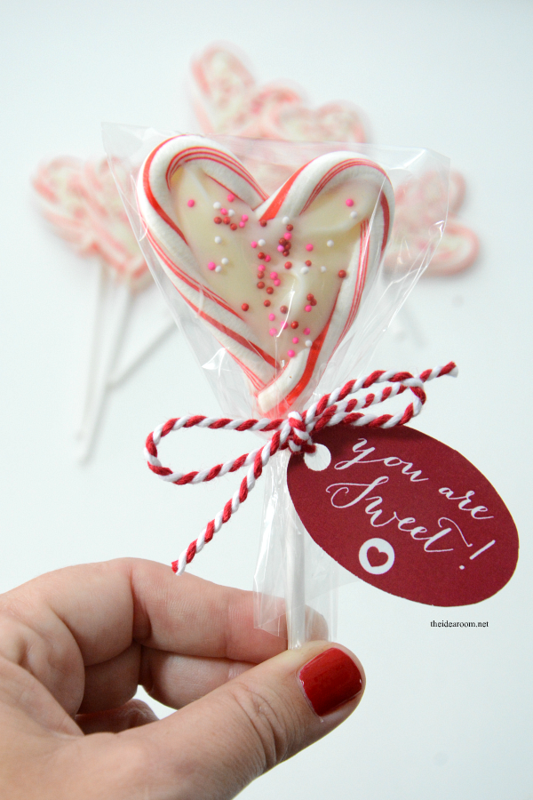 Mini Candy Cane Heart Suckers are so easy to make and are the perfect Valentine's Day treat of gift idea for friends, family and classmates.