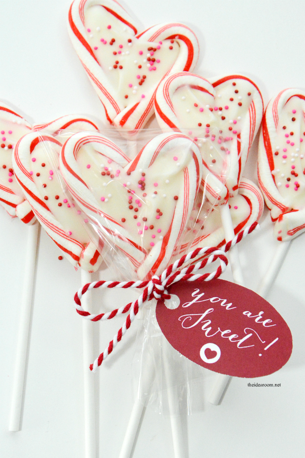 Mini Candy Cane Heart Suckers are so easy to make and are the perfect Valentine's Day treat of gift idea for friends, family and classmates.