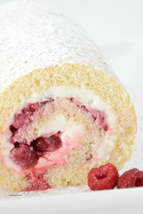Recipes | This Vanilla Raspberry Cake Roll is the perfect Valentine's Day Dessert. Moist and delicious cake rolled with cream cheese and raspberries.