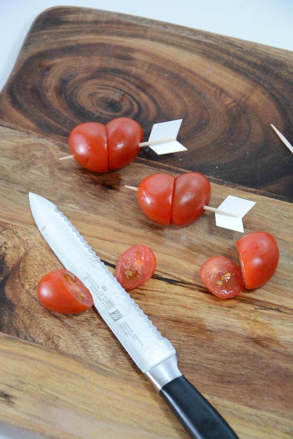 Valentine's Day | Create and serve up this fun Valentine's Day Salad by making these "heart shaped" tomatoes and sliced carrots. 
